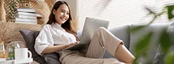 Woman sitting with  a computer 