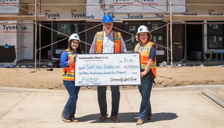 Community West Bank presenting affordable housing grant check to Self-Help Enterprises at Rancho Colegio housing development