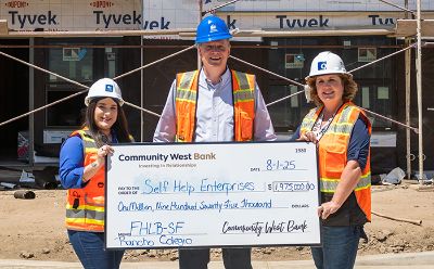 Community West Bank presenting affordable housing grant check to Self-Help Enterprises at Rancho Colegio housing development