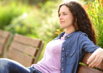 Woman relaxing on bench 