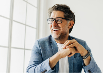 man in glasses and beard smiling 